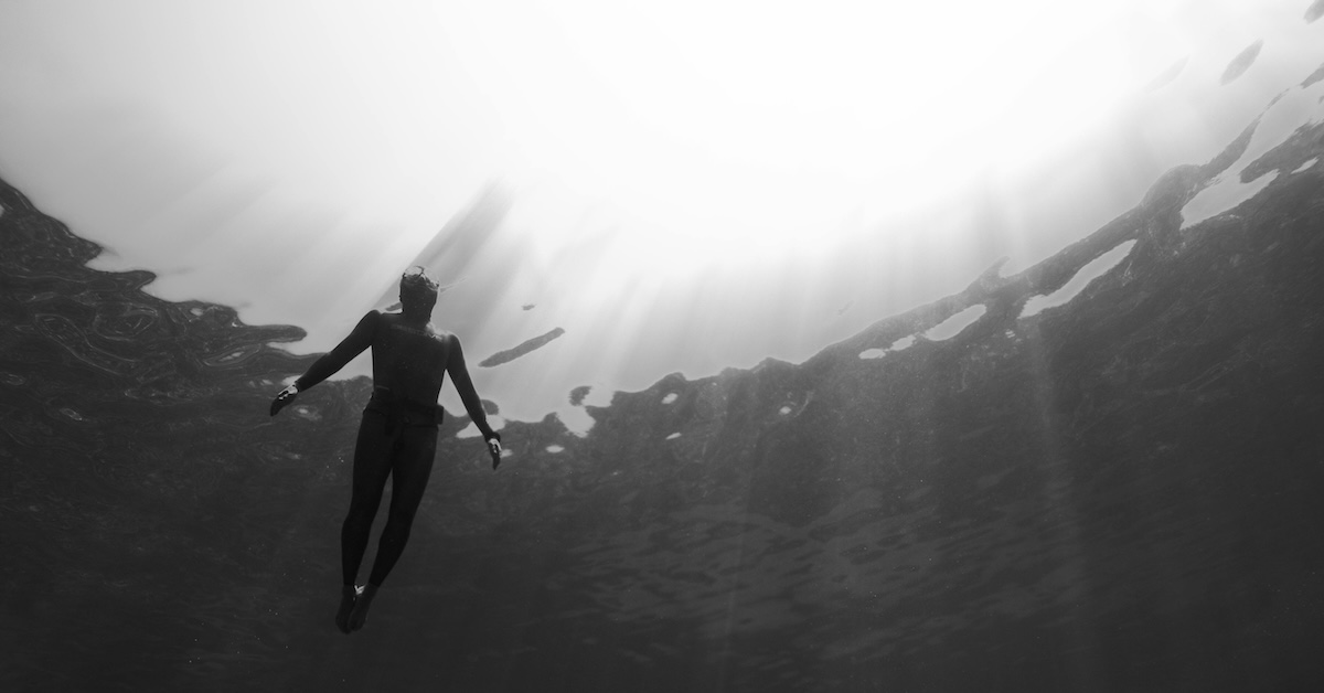 Human Diver in Ocean absorbing Nature